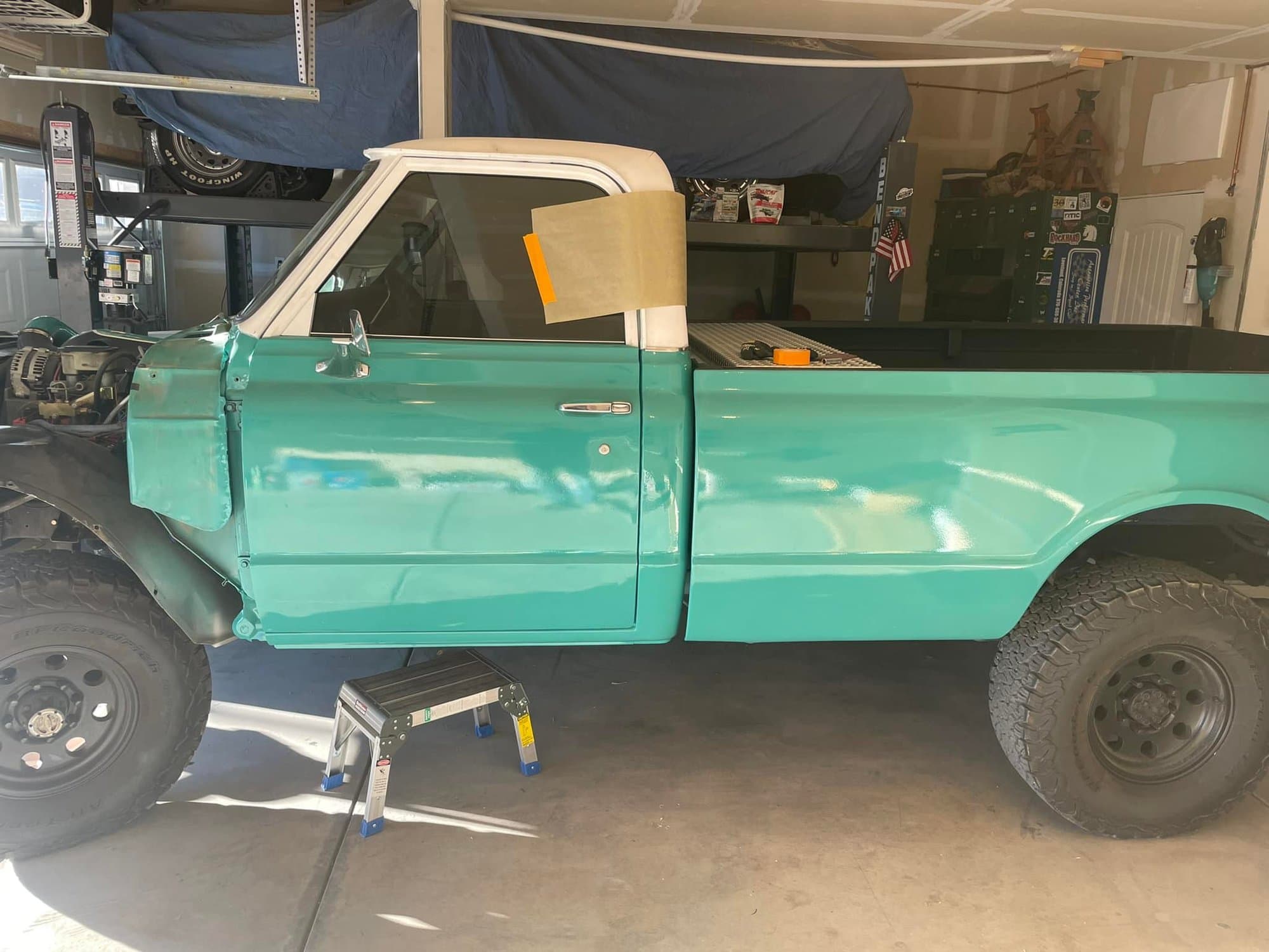 C10 in the shop — fresh teal paint and body work